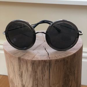 Round dark tortoise shell sunglasses